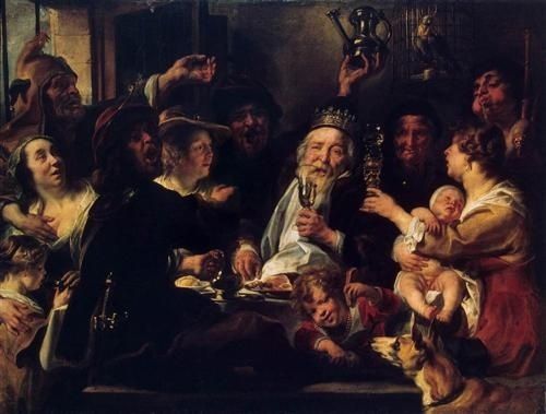 Historisch feestmaal met een uitgedoste koning en een baby op schoot